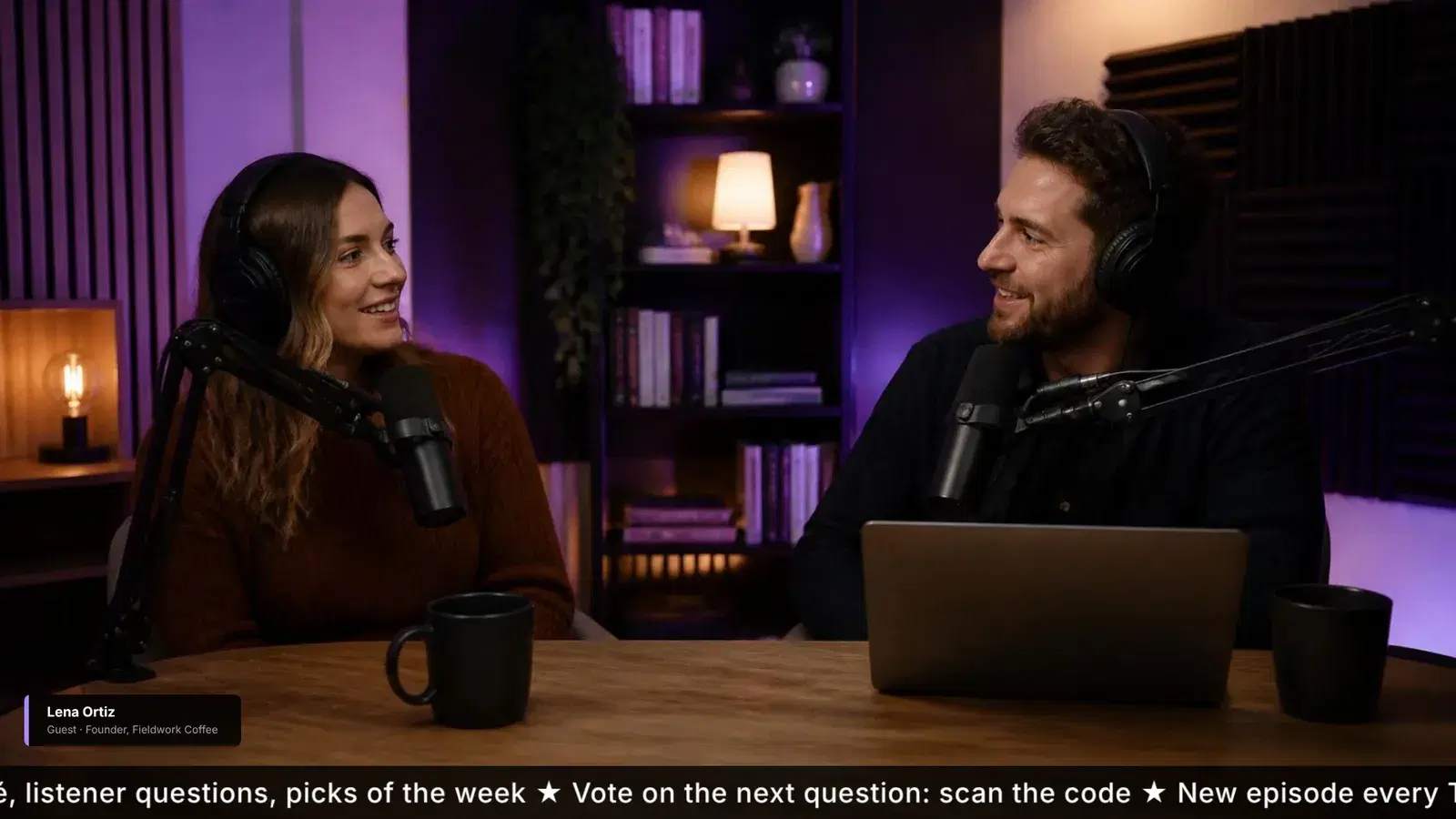 Two podcast hosts at microphones in a warm studio, a guest name card at the lower left and a scrolling topic ticker along the bottom.