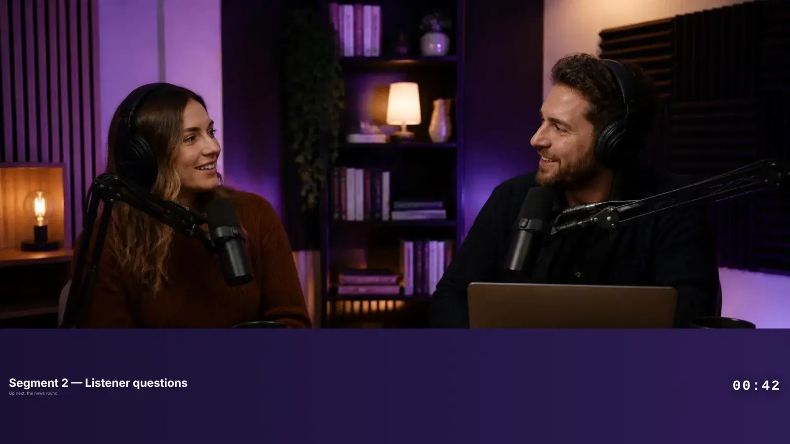 The same two hosts with a purple band across the bottom of the frame reading Segment 2, Listener questions, and a countdown at 00:42.