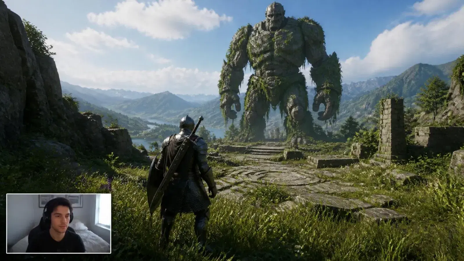 An action RPG stream in daylight, a knight facing a giant stone golem, with the streamer’s facecam in a white frame in the bottom-left corner.